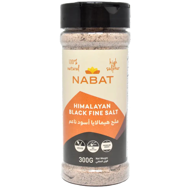 Mineral-rich black salt in a handy shaker, perfect for adding a unique savory touch to your dishes