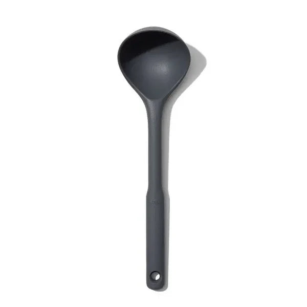 Durable OXO silicone ladle designed for everyday serving with a sleek peppercorn finish.