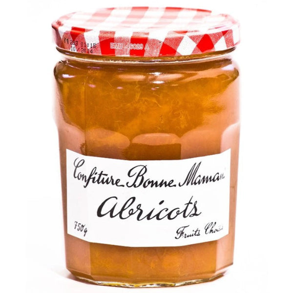A family‑size jar of traditional French apricot jam made with generous chunks of ripe apricots