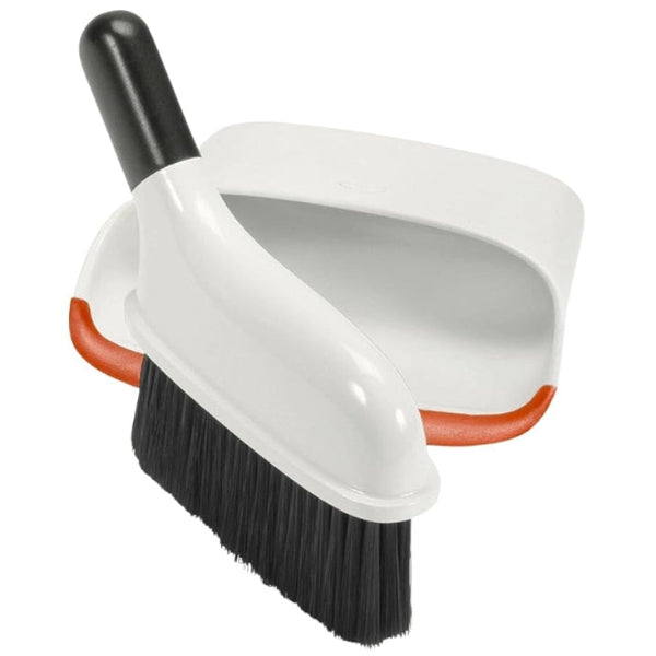 Sweep up small messes fast with this compact OXO dustpan and brush set, perfect for easy storage and quick cleanups.