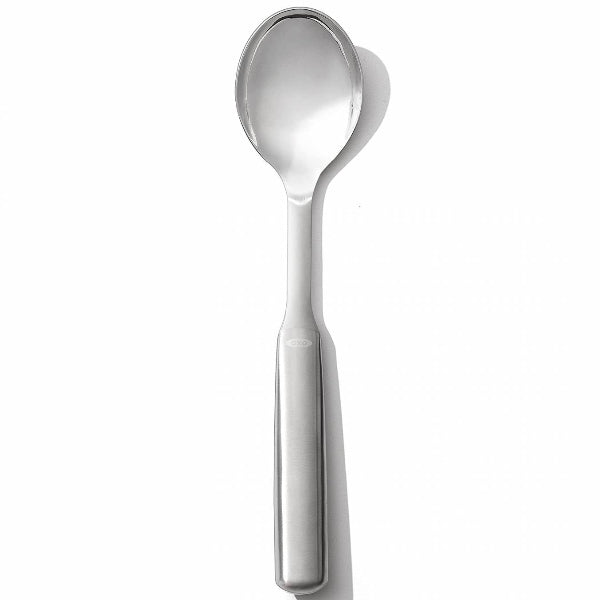 A sleek stainless steel serving spoon with a comfortable grip, perfect for dishing out everything from side dishes to hearty mains.