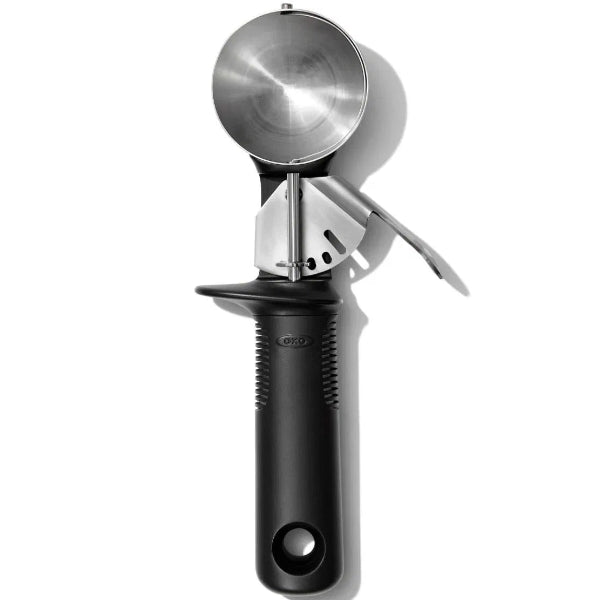 Solid stainless steel swipe ice cream scoop with a comfortable Good Grips handle for easy, smooth scooping.